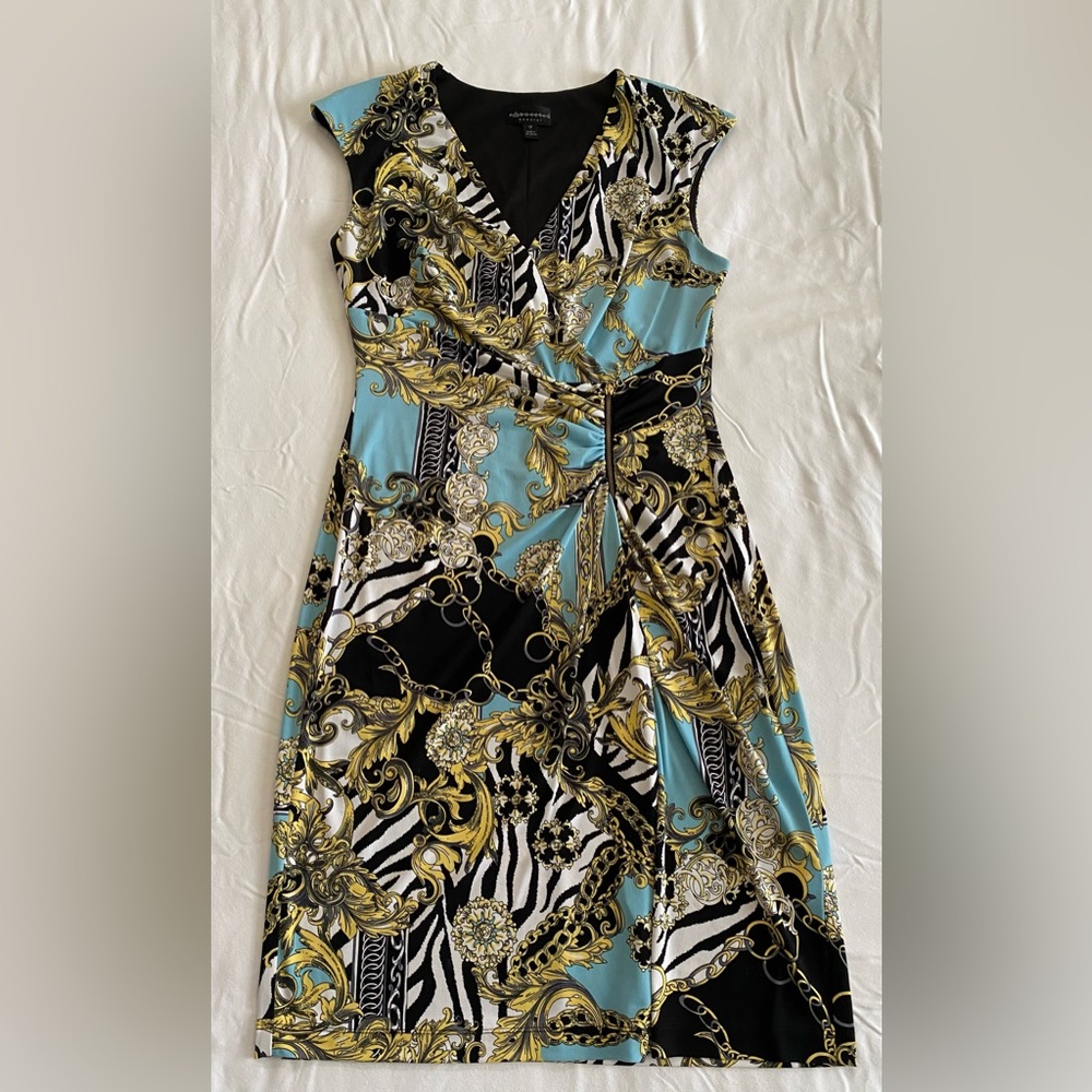 Size 10, blue, black & gold with zipper detail in the front